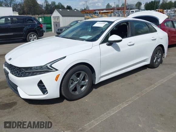 ✅ 2021 Kia K5 LXS • VIN: 5XXG14J23MG056148 • Лот: 41954998. Опубликован ранее на IAAI с пробегом 68 886 миль. Бесплатный доступ к архиву аукционных продаж из США и подробный отчёт об истории автомобиля на DreamBid. Изображение 2.