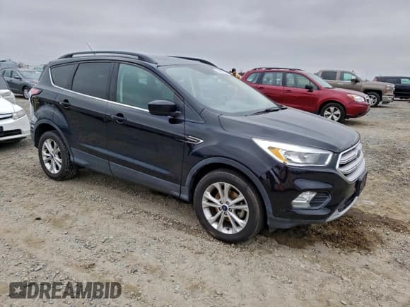✅ 2018 Ford Escape SE • VIN: 1FMCU0GD0JUC36969 • Lot: 94981265. Listed on Copart with 127,764 mi. Free auction sales archive from the USA and detailed vehicle history report at DreamBid. Image 4.