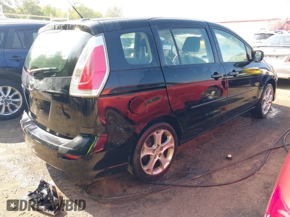 ✅ 2009 Mazda 5 Touring • VIN: JM1CR29L990340174 • Lot: 42209634. Wystawiony na IAAI z przebiegiem 190 460 mil. Bezpłatny archiwum sprzedaży aukcyjnych z USA i szczegółowy raport historii pojazdu na DreamBid. Zdjęcie 4.