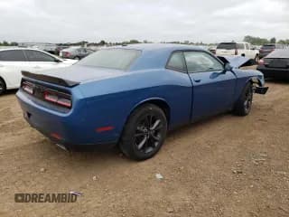 ✅ 2021 Dodge Challenger SXT • VIN: 2C3CDZGG0MH676379 • Lot: 65964614. Wystawiony na Copart z przebiegiem Nie podano. Bezpłatny archiwum sprzedaży aukcyjnych z USA i szczegółowy raport historii pojazdu na DreamBid. Zdjęcie 3.