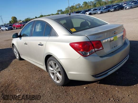 2013 Chevrolet Cruze LTZ z VIN 1G1PG5SB1D7120028, wystawiony jako IAAI lot #43409983 z przebiegiem 232 025 mil mil oraz . Historia ofert i sprzedaży dostępna na DreamBid. Obrazek 3.