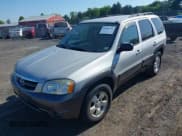 ✅ 2003 Mazda Tribute ES • VIN: 4F2CZ96123KM35666 • Lot: 42504796. Wystawiony na IAAI z przebiegiem 152 744 mil. Bezpłatny archiwum sprzedaży aukcyjnych z USA i szczegółowy raport historii pojazdu na DreamBid. Zdjęcie 2.