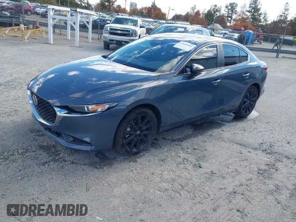 ✅ 2024 Mazda 3 S Carbon Edition • VIN: 3MZBPBCM9RM421270 • Lot: 43604481. Listed on IAAI with 23,354 mi. Free auction sales archive from the USA and detailed vehicle history report at DreamBid. Image 2.