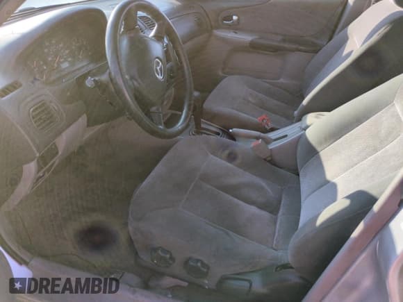 ✅ 2001 Mazda Protege DX • VIN: JM1BJ222110435658 • Lot: 46419725. Listed on Copart with Not provided. Free auction sales archive from the USA and detailed vehicle history report at DreamBid. Image 7.