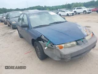 ✅ 2000 Saturn SL • VIN: 1G8ZF5280YZ108657 • Lot: 42414854. Listed on IAAI with 240,619 mi. Free auction sales archive from the USA and detailed vehicle history report at DreamBid. Image 1.