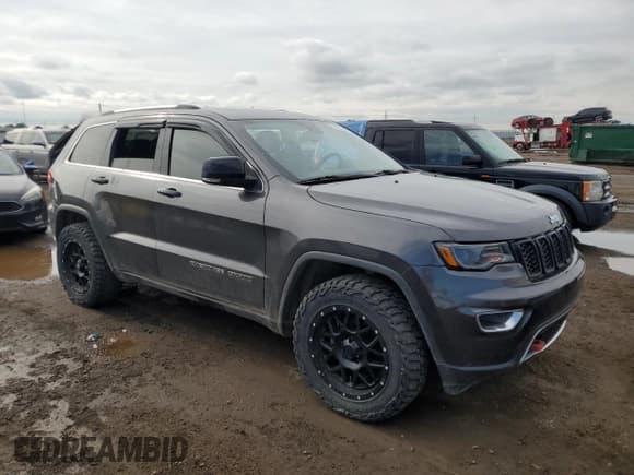 ✅ 2017 Jeep Grand Cherokee • VIN: 1C4HJFBG4HC728433 • Lot: 59215585. Listed on Copart with 143,085 mi. Free auction sales archive from the USA and detailed vehicle history report at DreamBid. Image 4.