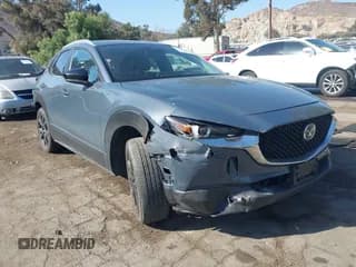 ✅ 2024 Mazda CX-30 S Carbon Edition • VIN: 3MVDMBCM8RM602766 • Лот: 43379386. Опубликован ранее на IAAI с пробегом 23 402 миль. Бесплатный доступ к архиву аукционных продаж из США и подробный отчёт об истории автомобиля на DreamBid. Изображение 1.