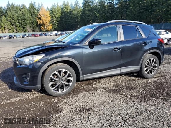 ✅ 2016 Mazda CX-5 Grand Touring • VIN: JM3KE4DY5G0764140 • Lot: 93164335. Listed on Copart with 97,167 mi. Free auction sales archive from the USA and detailed vehicle history report at DreamBid. Image 1.