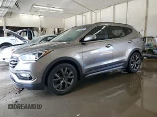 ✅ 2018 Hyundai Santa Fe Ultimate • VIN: 5XYZW4LA0JG527968 • Лот: 64858005. Опубликован ранее на Copart с пробегом 65 589 миль. Бесплатный доступ к архиву аукционных продаж из США и подробный отчёт об истории автомобиля на DreamBid. Изображение 1.