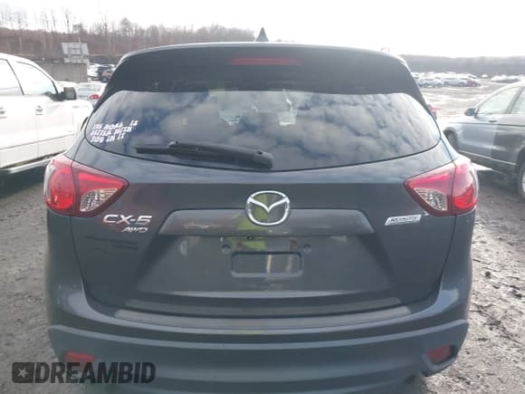 ✅ 2014 Mazda CX-5 Grand Touring • VIN: JM3KE4DY6E0348241 • Lot: 43764952. Wystawiony na IAAI z przebiegiem 149 149 mil. Bezpłatny archiwum sprzedaży aukcyjnych z USA i szczegółowy raport historii pojazdu na DreamBid. Zdjęcie 16.