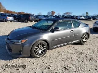 ✅ 2014 Scion tC Monogram • VIN: JTKJF5C7XE3084772 • Lot: 90256205. Listed on Copart with 158,170 mi. Free auction sales archive from the USA and detailed vehicle history report at DreamBid. Image 1.