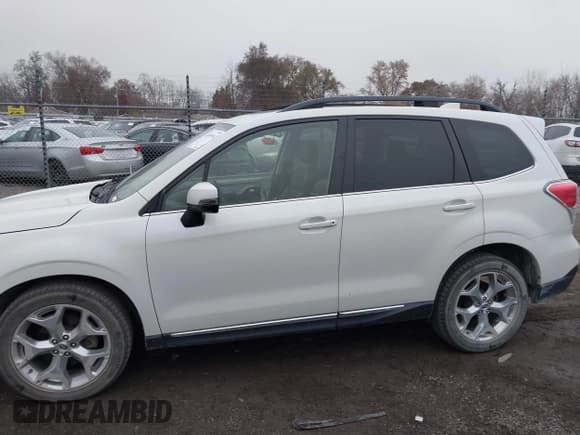 ✅ 2017 Subaru Forester Touring • VIN: JF2SJAWC9HH808164 • Lot: 43699516. Listed on IAAI with 102,065 mi. Free auction sales archive from the USA and detailed vehicle history report at DreamBid. Image 14.