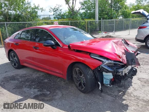 ✅ 2025 Kia K5 GT-Line • VIN: KNAG64J71S5320589 • Lot: 42540321. Listed on IAAI with 13,705 mi. Free auction sales archive from the USA and detailed vehicle history report at DreamBid. Image 1.