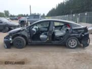 ✅ 2021 Toyota Prius LE • VIN: JTDKAMFP0M3179016 • Lot: 42204095. Listed on IAAI with 34,691 mi. Free auction sales archive from the USA and detailed vehicle history report at DreamBid. Image 15.