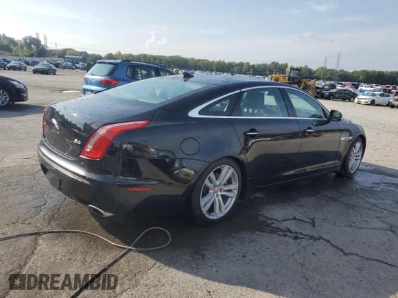 ✅ 2014 Jaguar XJ Portfolio • VIN: SAJWA2GZ1E8V61311 • Lot: 81485885. Listed on Copart with 133,168 mi. Free auction sales archive from the USA and detailed vehicle history report at DreamBid. Image 3.