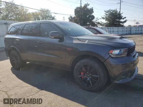 2018 Dodge Durango SRT z VIN 1C4SDJGJ2JC169843, wystawiony jako Copart lot #71884965 z przebiegiem Nie podano mil oraz Czysty tytuł • Clean title. Historia ofert i sprzedaży dostępna na DreamBid. Obrazek 4.
