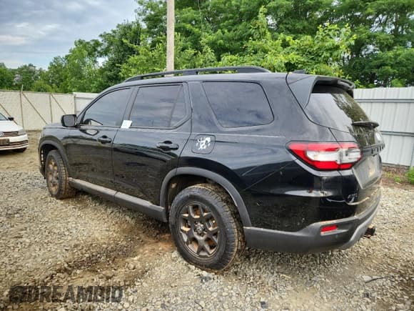 ✅ 2025 Honda Pilot TrailSport • VIN: 5FNYG1H60SB080790 • Лот: 65093595. Опубликован ранее на Copart с пробегом Не указан. Бесплатный доступ к архиву аукционных продаж из США и подробный отчёт об истории автомобиля на DreamBid. Изображение 2.