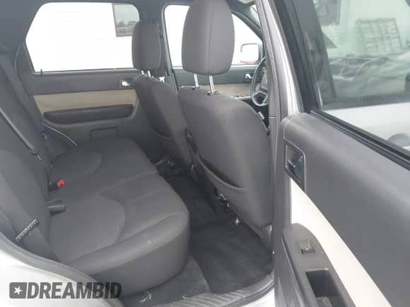 2010 Mercury Mariner with VIN 4M2CN8B76AKJ09411, listed as a IAAI auction lot 42386510 with 113,126 mi miles and . Bid and sale history available at DreamBid. Image 8.