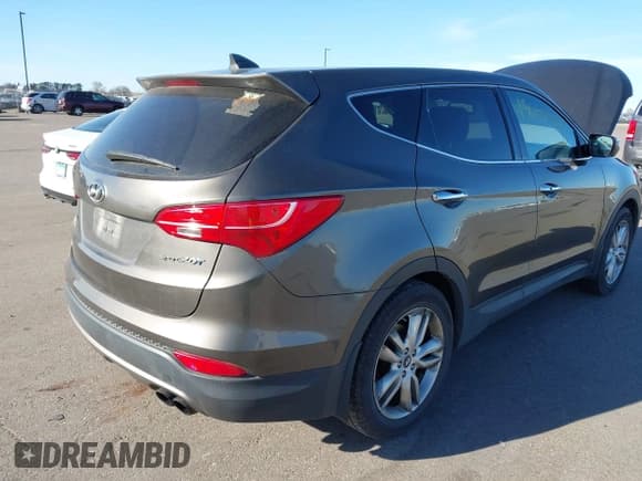 ✅ 2013 Hyundai Santa Fe Sport • VIN: 5XYZW3LA5DG040716 • Lot: 43681898. Listed on IAAI with 214,736 mi. Free auction sales archive from the USA and detailed vehicle history report at DreamBid. Image 4.