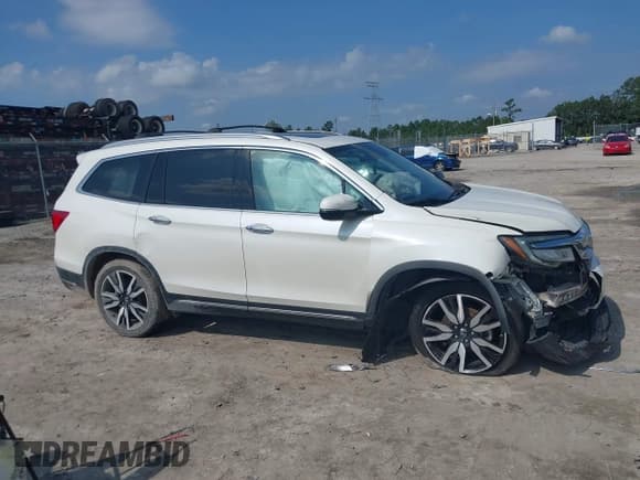 ✅ 2019 Honda Pilot Touring 8-Passenger • VIN: 5FNYF5H9XKB001842 • Lot: 43026784. Listed on IAAI with 114,674 mi. Free auction sales archive from the USA and detailed vehicle history report at DreamBid. Image 14.