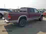 2000 Dodge Dakota Sport с VIN 1B7GG2AN1YS699073, выставлен на аукционе Copart как лот 70782284 с пробегом 141 876 миль миль и Списание • Salvage title. История ставок и продаж доступна на DreamBid. Изображение 3.