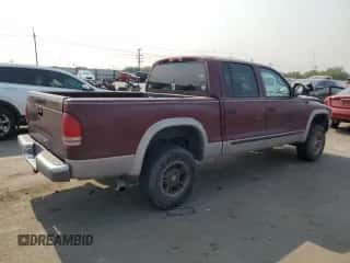 2000 Dodge Dakota Sport z VIN 1B7GG2AN1YS699073, wystawiony jako Copart lot #70782284 z przebiegiem 141 876 mil mil oraz Szkoda całkowita • Salvage title. Historia ofert i sprzedaży dostępna na DreamBid. Obrazek 3.