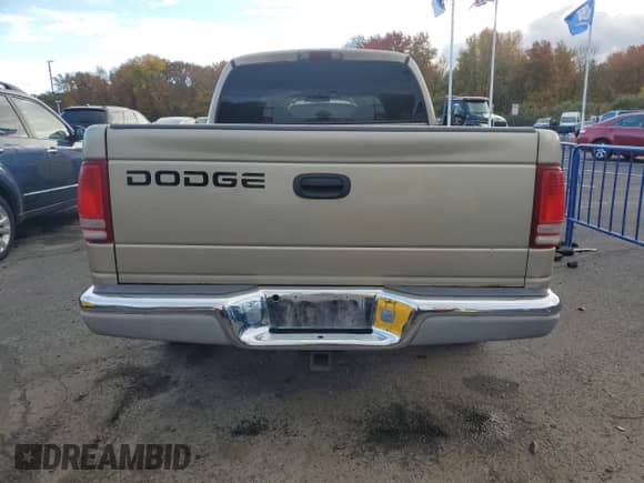 2002 Dodge Dakota SLT z VIN 1B7HL48X02S720473, wystawiony jako Copart lot #86873285 z przebiegiem 74 633 mil mil oraz Czysty tytuł • Clean title. Historia ofert i sprzedaży dostępna na DreamBid. Obrazek 6.