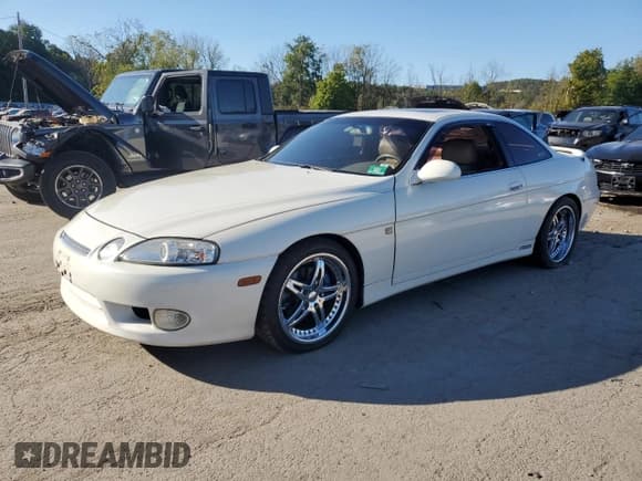 ✅ 1999 Lexus SC 400 • VIN: JT8CH32Y6X1002865 • Lot: 82233355. Listed on Copart with 387,574 mi. Free auction sales archive from the USA and detailed vehicle history report at DreamBid. Image 1.
