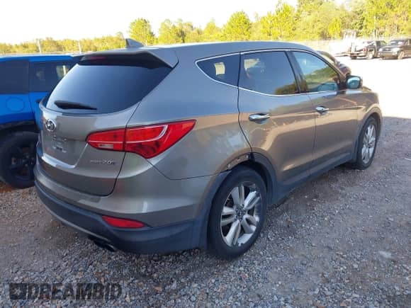 2013 Hyundai Santa Fe Sport z VIN 5XYZW3LA2DG022738, wystawiony jako IAAI lot #43487493 z przebiegiem 169 663 mil mil oraz . Historia ofert i sprzedaży dostępna na DreamBid. Obrazek 4.