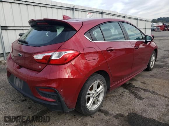 ✅ 2018 Chevrolet Cruze LT • VIN: 3G1BE6SM4JS526857 • Lot: 61126152. Listed on Copart with 127,435 mi. Free auction sales archive from the USA and detailed vehicle history report at DreamBid. Image 4.