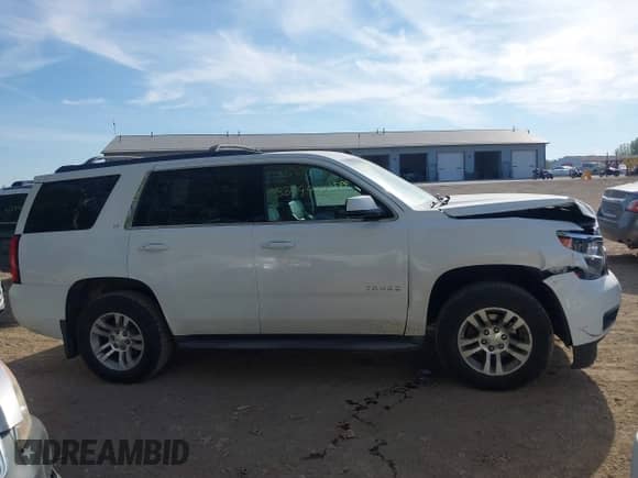 2015 Chevrolet Tahoe LT z VIN 1GNSKBKC3FR279459, wystawiony jako IAAI lot #43349972 z przebiegiem 112 043 mil mil oraz . Historia ofert i sprzedaży dostępna na DreamBid. Obrazek 13.