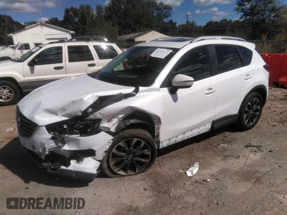 ✅ 2016 Mazda CX-5 Grand Touring • VIN: JM3KE2DY0G0695894 • Lot: 43441374. Wystawiony na IAAI z przebiegiem 112 838 mil. Bezpłatny archiwum sprzedaży aukcyjnych z USA i szczegółowy raport historii pojazdu na DreamBid. Zdjęcie 16.