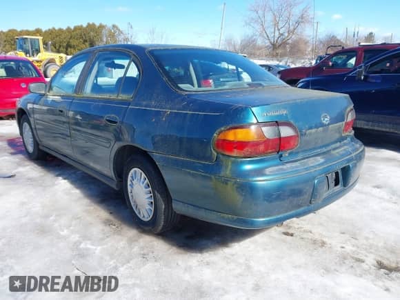 2002 Chevrolet Malibu z VIN 1G1ND52J72M569039, wystawiony jako IAAI lot #41668349 z przebiegiem 105 161 mil mil oraz . Historia ofert i sprzedaży dostępna na DreamBid. Obrazek 3.