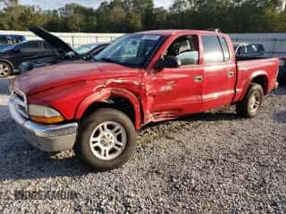 2004 Dodge Dakota SLT z VIN 1D7HL48K04S781707, wystawiony jako Copart lot #74326284 z przebiegiem 190 531 mil mil oraz Czysty tytuł • Clean title. Historia ofert i sprzedaży dostępna na DreamBid. Obrazek 1.