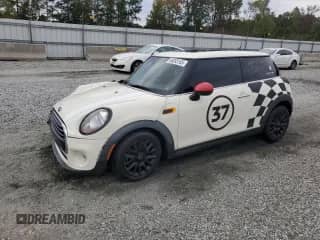 2016 MINI Hardtop with VIN WMWXP5C53GT739898, listed as a Copart auction lot 86093165 with 76,458 mi miles and Salvage title. Bid and sale history available at DreamBid. Image 1.