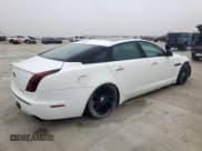 ✅ 2014 Jaguar XJ Portfolio • VIN: SAJWA2GZ0E8V59176 • Lot: 71057635. Listed on Copart with 111,064 mi. Free auction sales archive from the USA and detailed vehicle history report at DreamBid. Image 3.