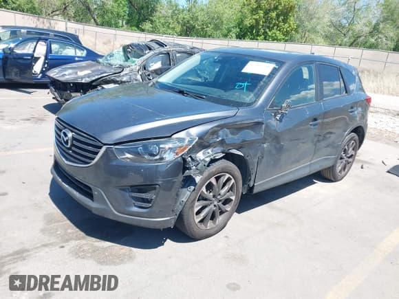 ✅ 2016 Mazda CX-5 Grand Touring • VIN: JM3KE4DY3G0912088 • Lot: 42203530. Wystawiony na IAAI z przebiegiem 86 914 mil. Bezpłatny archiwum sprzedaży aukcyjnych z USA i szczegółowy raport historii pojazdu na DreamBid. Zdjęcie 2.