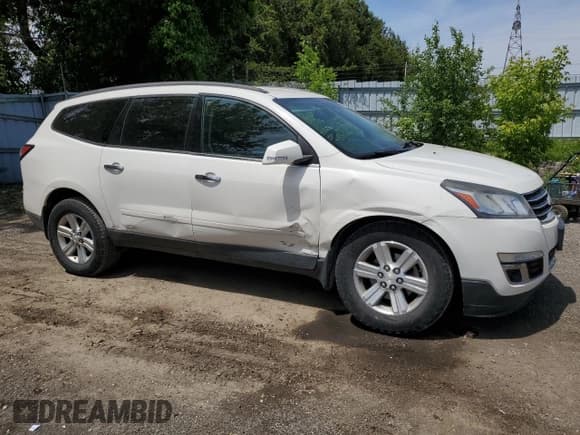 ✅ 2013 Chevrolet Traverse LT • VIN: 1GNKRGKDXDJ256810 • Lot: 57332035. Listed on Copart with 128,990 mi. Free auction sales archive from the USA and detailed vehicle history report at DreamBid. Image 4.