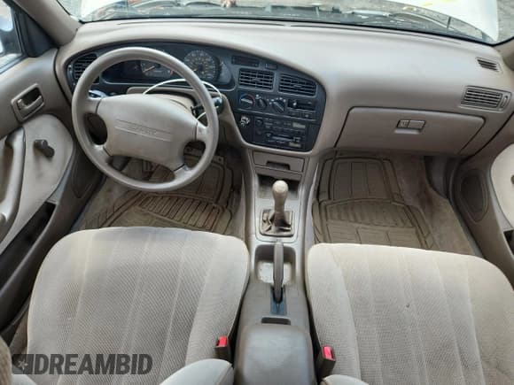 ✅ 1993 Toyota Camry DLX • VIN: 4T1SK11E6PU180747 • Lot: 64990075. Wystawiony na Copart z przebiegiem 109 692 mil. Bezpłatny archiwum sprzedaży aukcyjnych z USA i szczegółowy raport historii pojazdu na DreamBid. Zdjęcie 8.