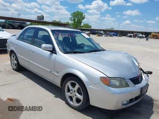 ✅ 2001 Mazda Protege LX • VIN: JM1BJ225410493032 • Lot: 42220585. Wystawiony na IAAI z przebiegiem 185 267 mil. Bezpłatny archiwum sprzedaży aukcyjnych z USA i szczegółowy raport historii pojazdu na DreamBid. Zdjęcie 1.