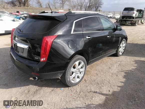 ✅ 2016 Cadillac SRX Performance Collection • VIN: 3GYFNCE32GS505552 • Lot: 40949642. Listed on IAAI with 143,343 mi. Free auction sales archive from the USA and detailed vehicle history report at DreamBid. Image 4.