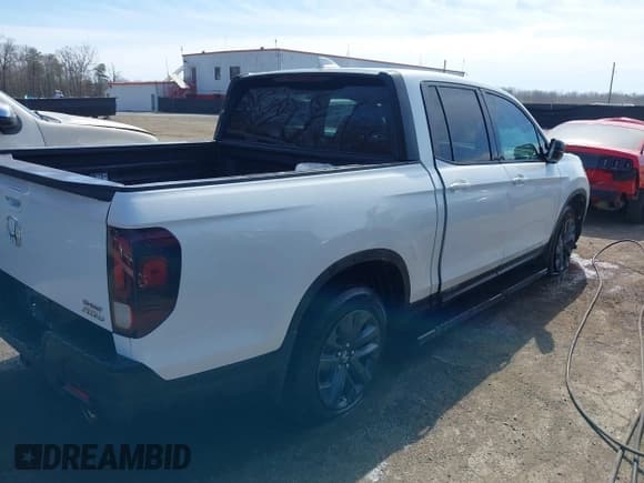 ✅ 2022 Honda Ridgeline Sport • VIN: 5FPYK3F12NB009135 • Lot: 41705000. Listed on IAAI with 50,551 mi. Free auction sales archive from the USA and detailed vehicle history report at DreamBid. Image 4.