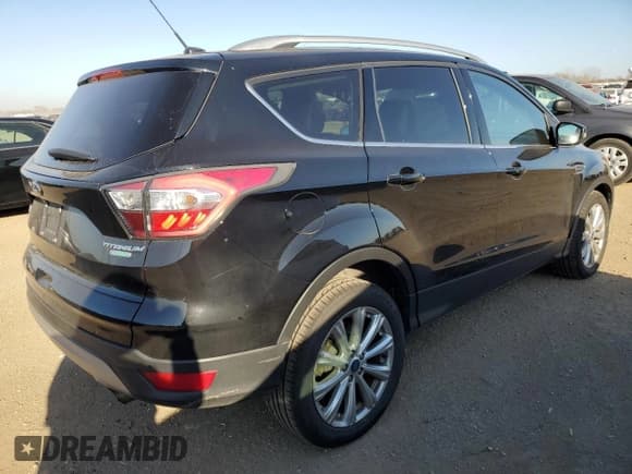 ✅ 2017 Ford Escape Titanium • VIN: 1FMCU0JD6HUA80424 • Lot: 92457605. Wystawiony na Copart z przebiegiem 86 139 mil. Bezpłatny archiwum sprzedaży aukcyjnych z USA i szczegółowy raport historii pojazdu na DreamBid. Zdjęcie 3.
