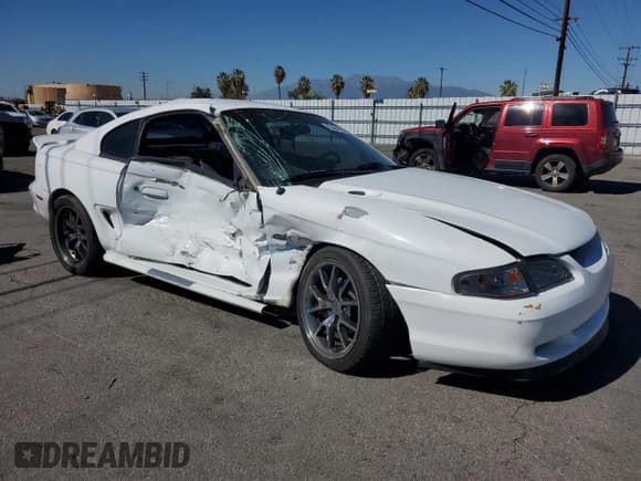 ✅ 1998 Ford Mustang GT • VIN: 1FAFP42X9WF179805 • Lot: 82494395. Listed on Copart with 142,724 mi. Free auction sales archive from the USA and detailed vehicle history report at DreamBid. Image 4.