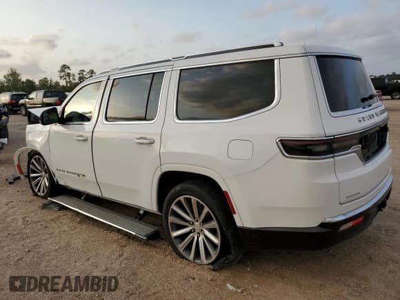 ✅ 2023 Jeep Grand Wagoneer • VIN: 1C4SJVEJ0PS545778 • Lot: 78696014. Listed on Copart with 27,771 mi. Free auction sales archive from the USA and detailed vehicle history report at DreamBid. Image 2.