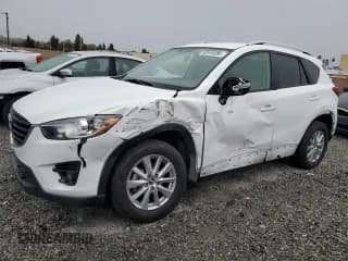 ✅ 2016 Mazda CX-5 Touring • VIN: JM3KE2CY7G0756255 • Lot: 92949285. Listed on Copart with 48,499 mi. Free auction sales archive from the USA and detailed vehicle history report at DreamBid. Image 1.