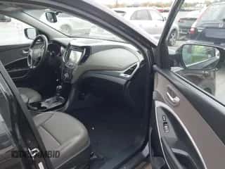 2016 Hyundai Santa Fe z VIN 5XYZUDLB2GG317413, wystawiony jako IAAI lot #43524563 z przebiegiem 167 905 mil mil oraz . Historia ofert i sprzedaży dostępna na DreamBid. Obrazek 5.