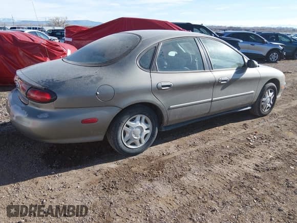 ✅ 1999 Ford Taurus SE • VIN: 1FAFP53U1XG314975 • Lot: 43888557. Wystawiony na IAAI z przebiegiem 109 373 mil. Bezpłatny archiwum sprzedaży aukcyjnych z USA i szczegółowy raport historii pojazdu na DreamBid. Zdjęcie 4.