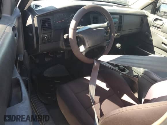 2003 Dodge Dakota с VIN 1D7HG12X93S267179, выставлен на аукционе Copart как лот 74291174 с пробегом Не указан миль и На запчасти • Non repairable. История ставок и продаж доступна на DreamBid. Изображение 8.