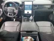 ✅ 2023 Ford F-150 Lightning Lariat • VIN: 1FTVW1EV0PWG12849 • Lot: 87083755. Listed on Copart with 35,557 mi. Free auction sales archive from the USA and detailed vehicle history report at DreamBid. Image 8.